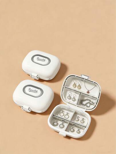 1个全新双层独立7格迷你首饰收纳盒，透明内衬，便携式旅行药盒，胶囊式设计，防水防潮，可放入口袋或包包，不占空间，多功能收纳盒，适合放置耳环、项链、戒指、首饰、维生素、药品和营养补充剂，桌面小物，家庭旅行必备配件，（黑色、白色、粉色可选）可重复使用，男女通用