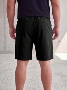 Pantalones cortos para hombre de talla grande, pantalones de pierna recta elástica de 5 pulgadas para verano, unicolor, bolsillos con cremallera, cordón, ligeros, para deportes, correr y fitness - Negro - Ver 5