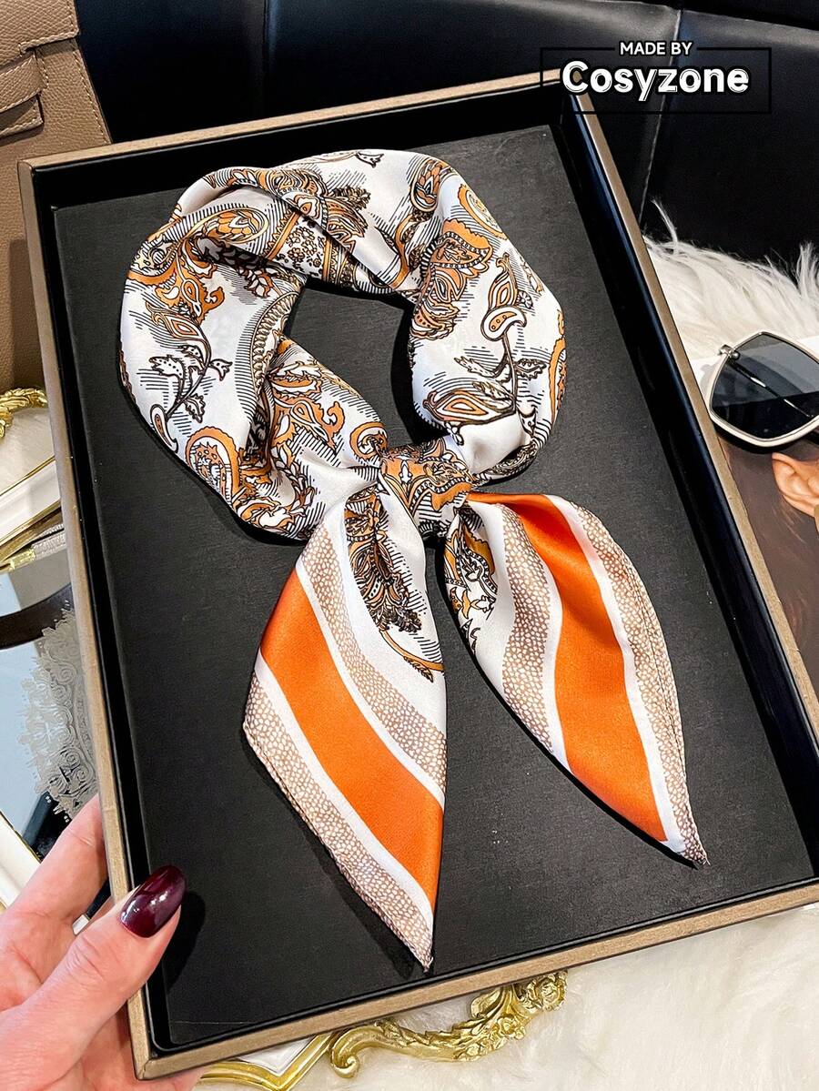 一条优雅的佩斯利印花27.5英寸方巾，适合休闲和街头穿搭，可用作头巾、发带、头巾，也是户外防晒配饰，为您的服装、海滩和假期增添亮点。 - 橘色 - 查看 1