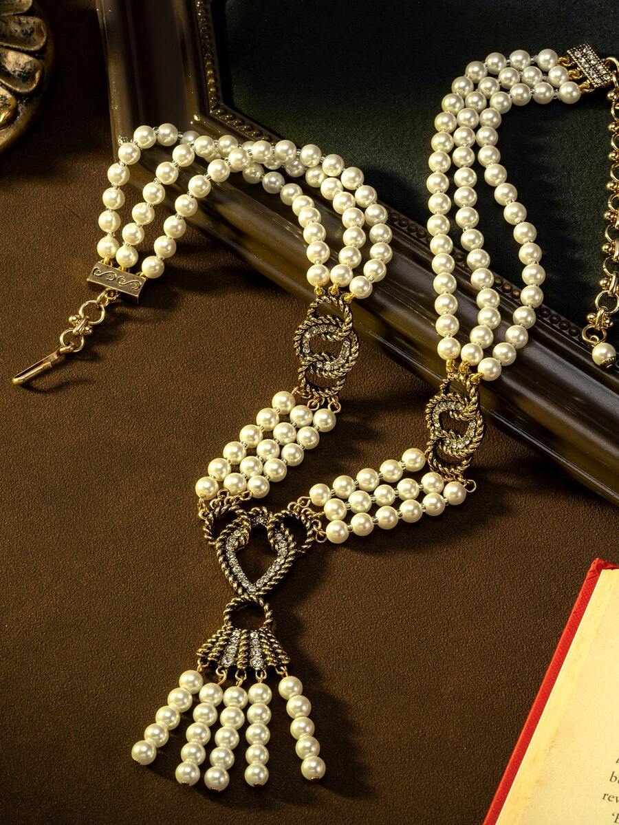 Vintage Luxurious Double-Layer Pearl Twist Chain Tassel Necklace | A Captivating Choice For Palace-Style Retro Parties. Featuring An Antique Copper Alloy Heart-Shaped Tassel Silhouette, Exquisite Craftsmanship Showcases A Retro Elegant Vibe, Suitable For Formal Dinners, Weddings, And Everyday Wear, Helping You Effortlessly Capture A Palace-Style Retro Ambiance. - Multicolor - View 1