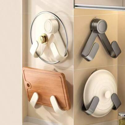 Organizador de parede sem furos com ganchos, suporte giratório para tampas de panelas, prateleira multifuncional para tábuas de corte na cozinha.