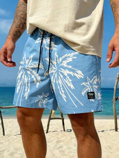 Quần short nam kiểu Hawaii màu xanh dương họa tiết cây cọ, có dây rút, thích hợp cho kỳ nghỉ biển.