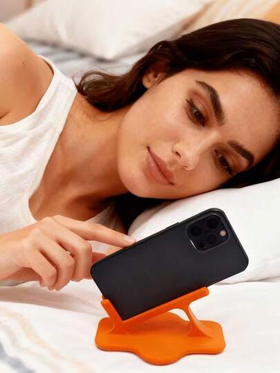 床头手机支架，防摔设计，适合懒散人士在床上或沙发上使用！符合人体工学的弧形底座，防滑握柄，采用耐用塑料制成，是躺着看视频的理想之选。