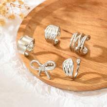 Bộ nhẫn hình nơ, nhẫn hở trơn nhẵn bằng kim loại không đối xứng với đường viền đá dung nham. - Nhiều màu - Xem 9