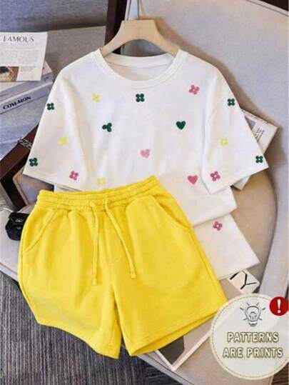 Conjunto casual de dos piezas para mujer - camiseta de manga corta con estampado de corazones + shorts con cordón, ropa cómoda adecuada para el uso diario.