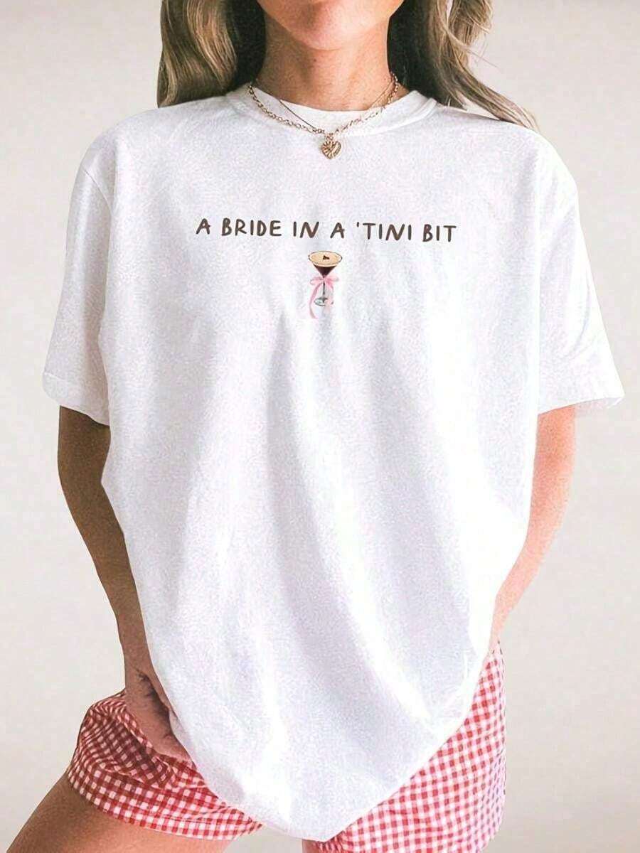 Graphic Cotton-Shirt A Bride In A Tini Bit Bride Shirt, Coquette EspresS-O-Artini Themed Future Mrs-Shirt, Tini Bit Engaged, Bridal Shower Idea FianceG Cotton-Shirt - White Top Is Family Gatherings And Vacations, Making It A Warm Family Members To Enjoy Ultimate ComfortWhite Top, Espresso Martini Trifecta Graphic Girl Men-Shirt Women's Casual Short Sleeve Crew Neck-Shirts - Holiday Season And Outdoor Activities Y2K,Oversize Plus Size Men's S To5XL,Summer Tee - 黑色 - 查看 1
