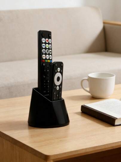 1个双孔遥控器收纳架，可容纳2个遥控器，采用简约的黑白配色，适用于电视、空调、照明遥控器以及办公用品。实用桌面收纳架