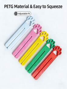 这款猫粮挤压器采用开口式设计，适用于大小两种尺寸的猫粮袋。它是一款便携式猫形膏状猫粮袋挤压器，配有符合人体工程学的把手。产品采用耐用的ABS材料制成，操作和清洁都非常方便。 - 多色 - 查看 3