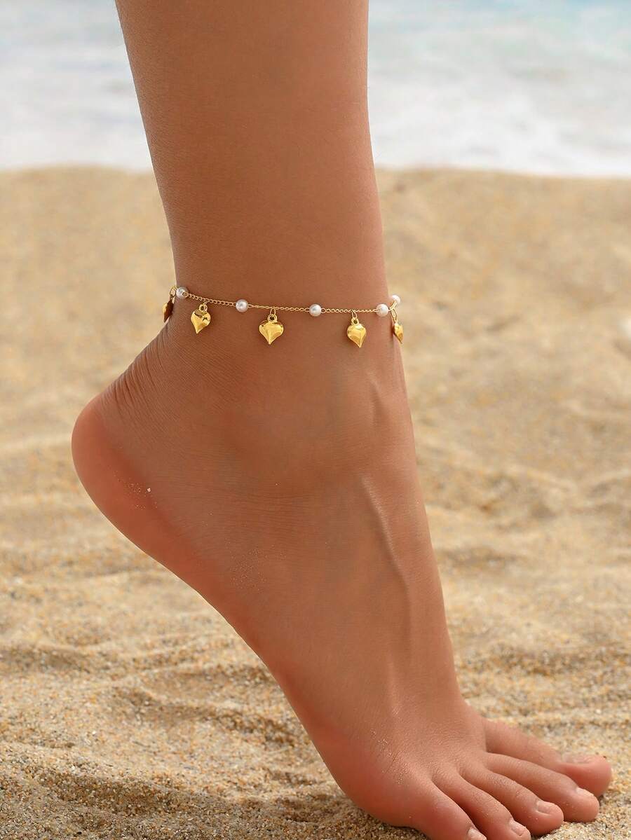1 chiếc vòng chân hình trái tim đính ngọc trai tinh tế, mang đến cảm giác nhẹ nhàng, phù hợp cho phụ nữ đeo vào mùa hè, đi biển và hẹn hò. - Vàng - Xem 1