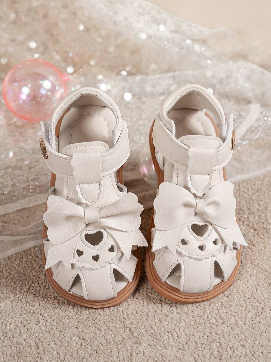 女童米色蝴蝶结镂空包头凉鞋，儿童软底防滑平底公主鞋，夏季款 - 米色 - 查看 1