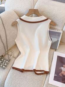 1 chiếc áo vest dệt kim không tay phối màu đen, trắng và nâu nhạt, kiểu dáng Pháp, ôm sát, cổ giả, thích hợp cho lễ hội và du lịch. - Nhiều màu - Xem 5
