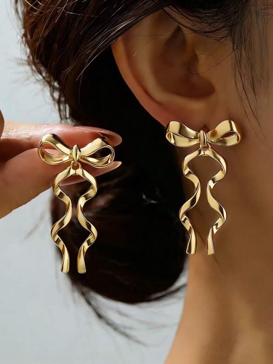 一对优雅的金色长蝴蝶结丝带耳环，女士款。 - 金色 - 查看 1