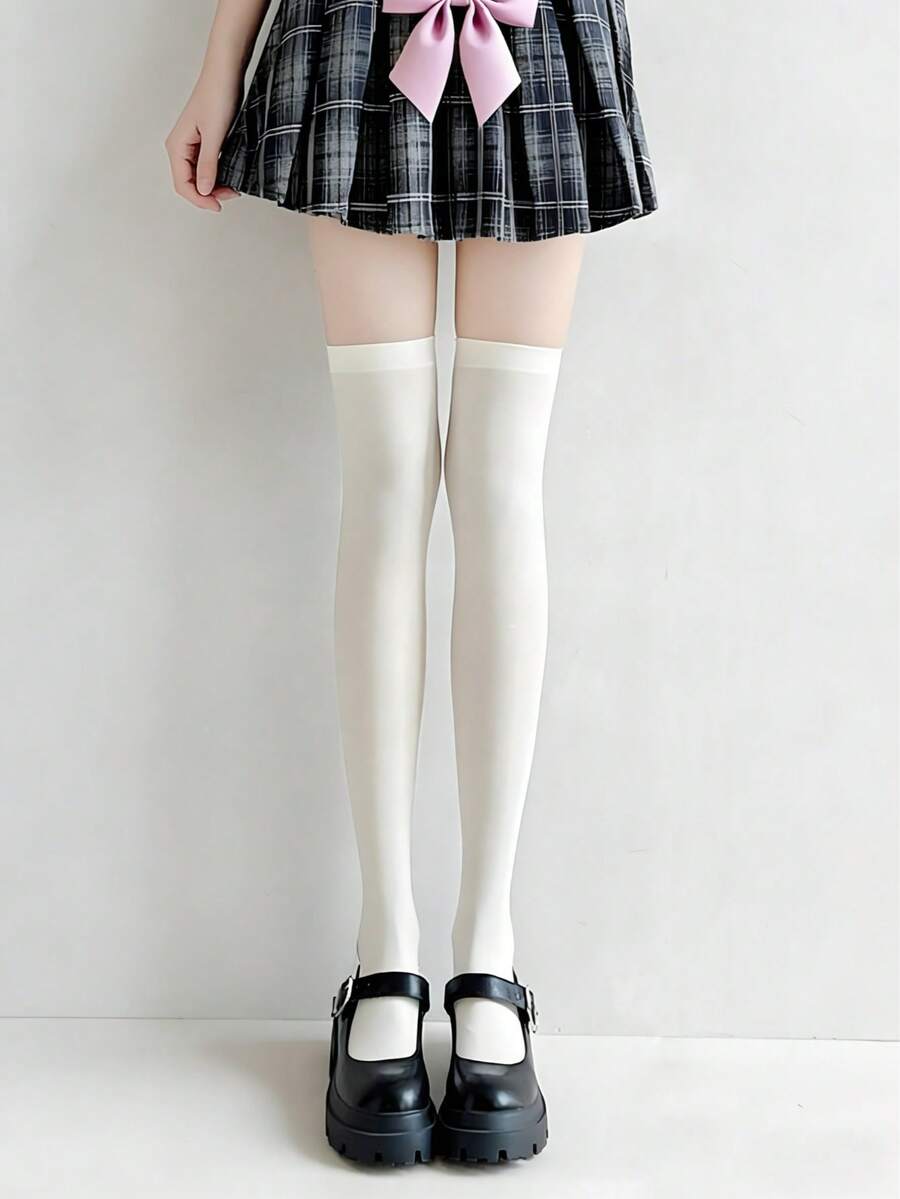 1 đôi tất nhung cao đến đầu gối, không xuyên thấu, bề mặt mờ, tạo hiệu ứng thon gọn.