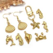 2 piezas Colgantes de metal de animales marinos de acero inoxidable dorado, con diseños de estrella de mar y delfín, para hacer joyería de verano y playa - Dorado - Ver 6