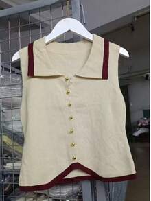 1 chiếc áo vest dệt kim không tay phối màu đen, trắng và nâu nhạt, kiểu dáng Pháp, ôm sát, cổ giả, thích hợp cho lễ hội và du lịch. - Nhiều màu - Xem 12