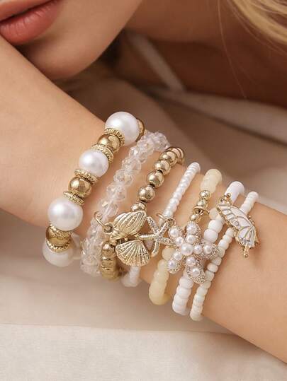 Set de 7 piezas de pulseras elásticas con cuentas, estrellas de mar, conchas y colgantes de mariposa en estilo bohemio primavera/verano, elegantes y hechas a mano, adecuadas para mujeres en la playa, fiestas, grandes reuniones, regalo perfecto para amigos, parejas, para usar en cualquier temporada, de manera casual o diaria