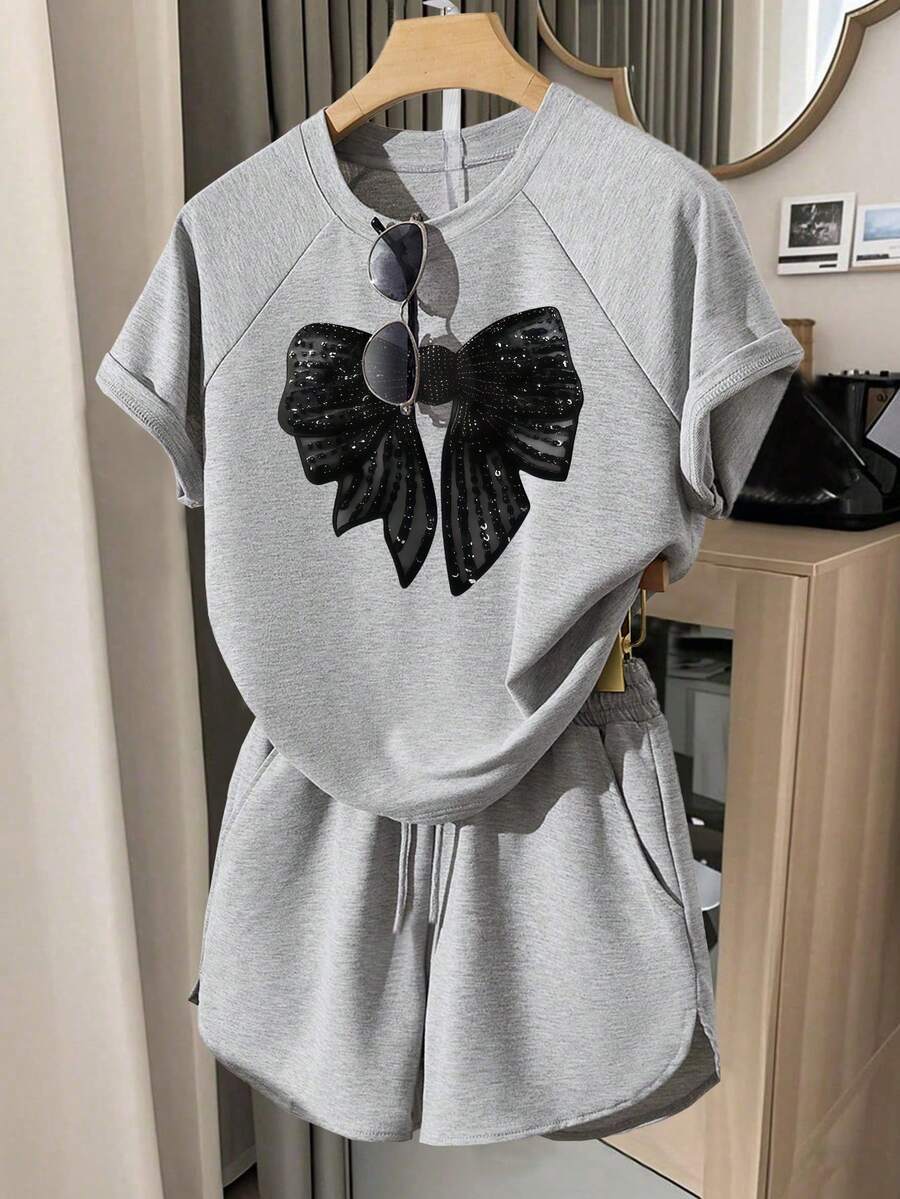 Bộ áo thun tay raglan dáng rộng in nơ cho bé gái - Xám - Xem 1
