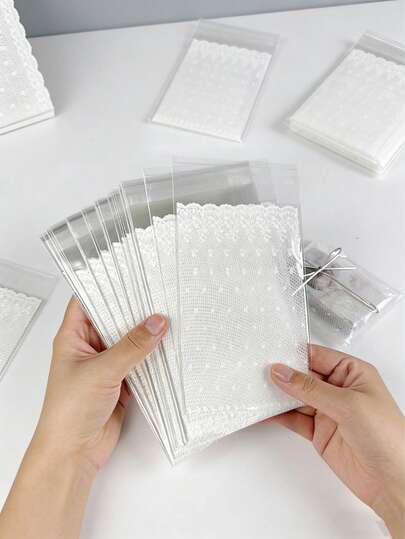 50 túi đựng quà in ren, túi đựng kẹo, bánh quy, quà tặng họa tiết hoa, túi OPP tự dính màu trắng đẹp mắt, nhiều kích cỡ. Dùng cho tiệc cưới, túi đựng quà tặng, túi đựng trang sức. (10/50 chiếc)