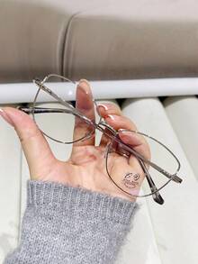 A Pair Of Women's Cat-Eye Glasses With Metal Frames, Featuring Clear Lenses And A Stylish, Versatile Design For Everyday Wear. - Silver - View 1