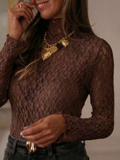 Áo nữ dáng ôm dài tay cổ cao xuyên thấu ren, kiểu Pháp cổ điển, mẫu mới về mùa xuân hè 2026, thích hợp mặc đi làm hoặc hẹn hò. Áo ren nền.