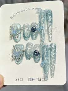 10片蓝色冰雪猫眼蝴蝶手工亚克力美甲贴片，蓝色渐变法式水波纹美甲，短椭圆和长尖指甲形状组合，冰透明法式3D花朵蝴蝶凝胶设计，爆款夏季简约蝴蝶水钻假指甲，DIY美甲用品，可重复使用，含果冻胶和指甲锉，日常佩戴，夏季手工美甲贴片 - 藍色 - 查看 1
