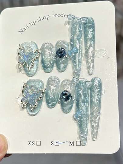 10 piezas Uñas postizas de acrílico hechas a mano con diseño de mariposa de ojo de gato azul hielo, arte de uñas con degradado azul y ondas de agua, combinación de forma oval corta y punta larga, diseño de flores 3D transparentes y mariposas de cristal, uñas postizas de verano con mariposas, suministros de uñas DIY, reutilizables, con pegamento de gelatina y lima de uñas, para uso diario