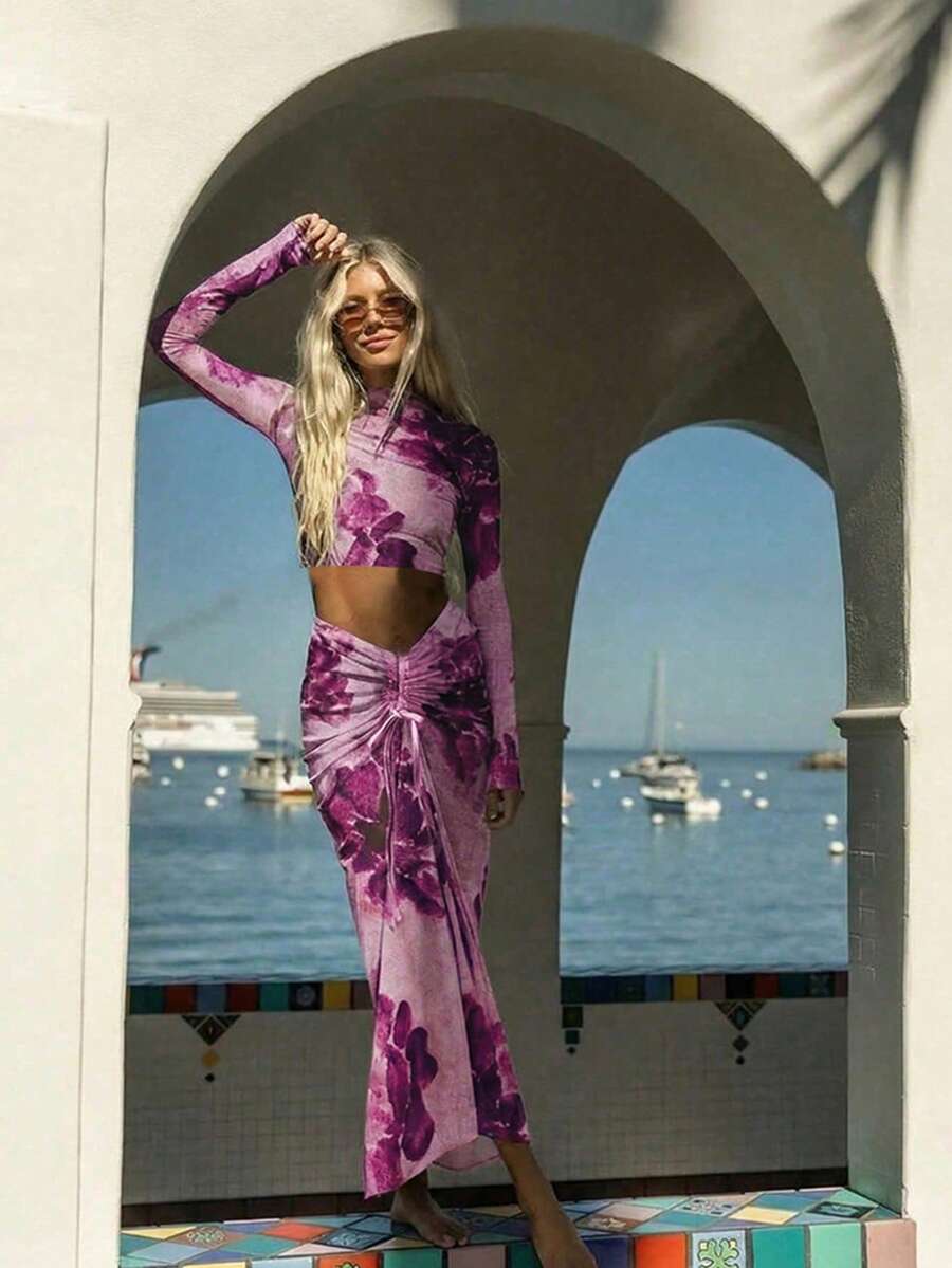 女士扎染网纱两件套。轻薄透气的网纱面料，带来清凉舒适的穿着体验。长袖露脐上衣凸显腰部线条，勾勒优美身形；抽绳褶皱中长裙则能修饰臀部和腰部曲线。充满夏日气息，是海滩度假的理想之选，轻松打造慵懒度假风。 - 玫紅色 - 查看 1