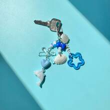 1 pieza Llavero con delfín y concha de estilo oceánico - Accesorio para bolso con colgante de estrella azul y corazón - Concha azul - Ver 7