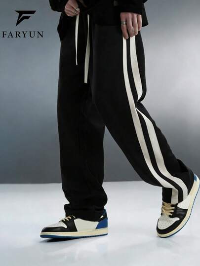 男士宽松直筒侧条纹休闲运动裤，适合街头、校园和日常穿着，春秋季款