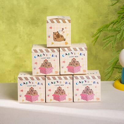 6/12个卡通生日惊喜礼盒，饰有水豚图案。内盒可放置独立首饰盒、小蛋糕和其他小礼物。每个盒子都包含一个幸运问号和卡通人脸图案，内含派对礼物、节日惊喜活动、寻宝游戏和抽奖奖品。采用坚固的纸板材质，主题独特。注意：此为空盒，不含任何礼物。