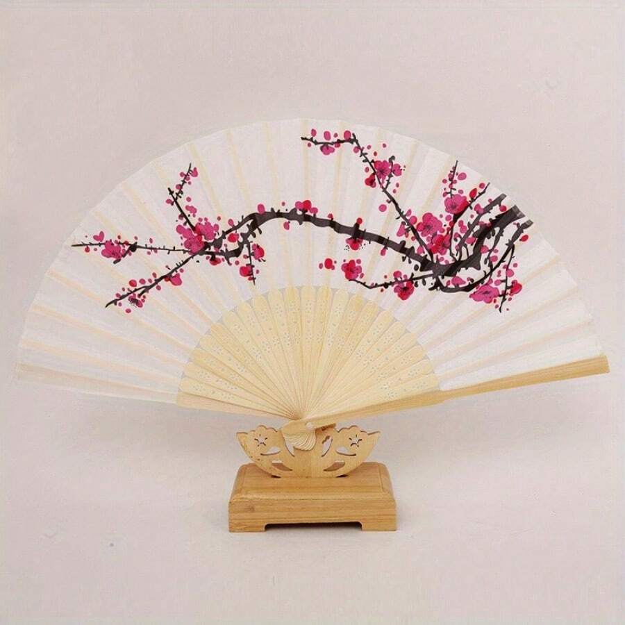 1 chiếc quạt vải họa tiết hoa anh đào - Chiếc quạt cầm tay thời trang với họa tiết hoa màu hồng và đen, một món quà trang nhã cho tiệc cưới và vật trang trí nhà cửa mang chủ đề hoa anh đào.