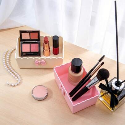 1 chiếc túi đựng mỹ phẩm và hộp đựng đồ trang điểm hình nơ, hộp đựng đồ trang trí phòng ngủ dùng để đựng cọ trang điểm, phụ kiện bàn làm việc, đồ dùng phòng tắm và phụ kiện phòng ngủ.