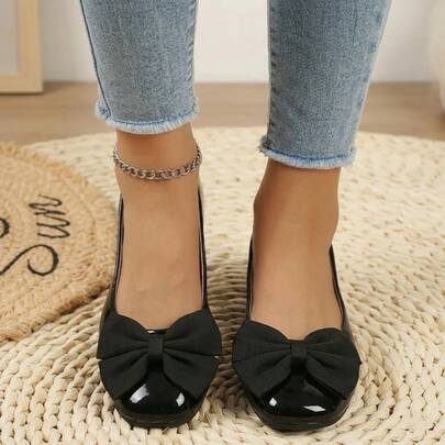 Giày búp bê nữ da bóng màu đen, có nơ trang trí, kiểu dáng casual, thích hợp đi làm, đi bộ và mang hàng ngày.