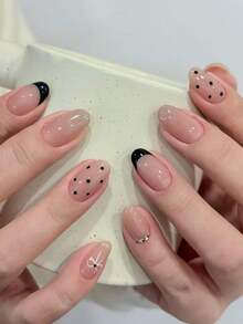 10片手工制作杏仁形黑色假指甲，法式尖头设计，黑色波点，渐变闪粉，白色钻石点缀，手绘白色蝴蝶结。简约多用途设计，时尚奢华高端质感。易于佩戴和卸除，方便打造各种美甲造型。 - 黑色 - 查看 1