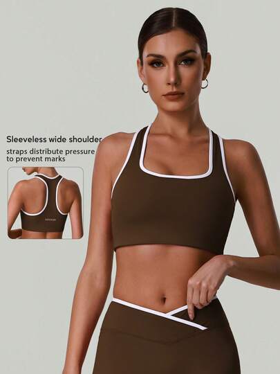 Áo tập thể thao nữ phối màu, cổ tròn rộng, dáng racerback, hỗ trợ cao, thích hợp cho mọi mùa.