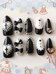 10片杏仁形黑白美甲贴纸 - 手工制作，Y2K风格甜美又前卫，饰有3D蝴蝶结、十字架和爱心图案，点缀珍珠和水钻，法式尖头美甲设计 | 可重复使用且可卸除的假指甲，适合女性和女孩 | 完美适用于哥特主题活动、派对和日常佩戴 | 内含1张胶贴和1个迷你指甲锉，方便使用 - 黑與白 - 查看 1