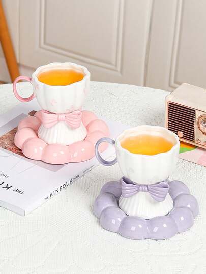 DearDali 1 tách cà phê gốm sứ nguyên bản và 1 đĩa lót, thiết kế nơ xinh xắn, thích hợp cho espresso, latte, dùng ở văn phòng, uống trà chiều, làm quà tặng ngày lễ hoặc quà tựu trường.