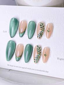 10片手工制作的按压式美甲贴片，短款美甲，假指甲，法式美甲贴片，杏仁形美甲，闪亮绿色猫眼美甲，裸色美甲，自然风美甲，春季美甲，手绘树叶和星爆图案，金色镶边和绿色水钻装饰，包含美甲工具，快速贴合和卸除，适合女性和女孩。绿色猫眼杏仁形美甲贴片 - 綠色 - 查看 3