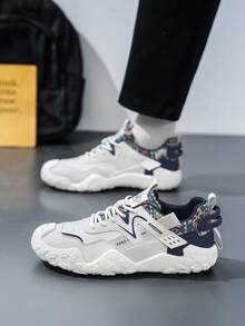 男士休闲时尚运动鞋，鞋跟印花，鞋面编织交叉绑带设计，呈现清新层次感十足的都市运动休闲风格。 - 灰色 - 查看 4