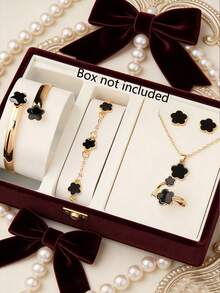 7件套奢华轻盈黑色花瓣女士腕表套装，包括一款多功能黑色表盘石英表、四叶草手链、手镯、项链、戒指和女士耳钉。玫瑰金表壳搭配黑色硅胶表带，尽显优雅品味。 - 黑色 - 查看 6