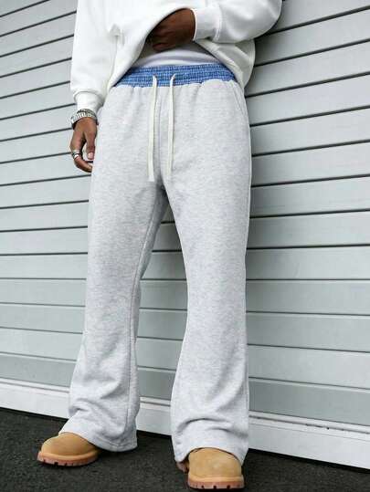 男士宽松直筒运动裤，腰部拼接设计，侧边口袋，舒适的春秋季运动风长裤，针织面料，耐穿材质