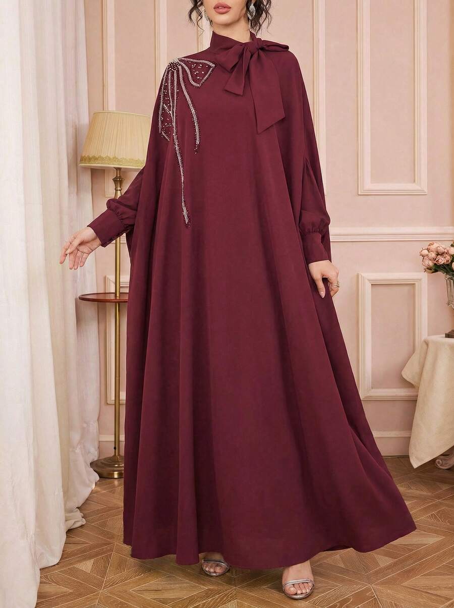 Solessence Elegant Maroon Woven Abaya With Tie Neck And Beaded Embroidery Half Batwing Sleeves Long Dress