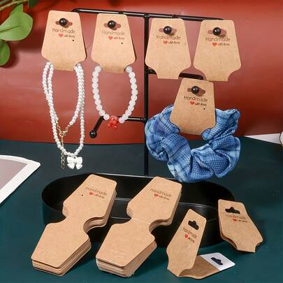 50/100pcs Kraft & White Jewelry Display Cards With Self-Adhesive Backing - Rustic Board Retail Packaging For Necklaces, Earrings, Bracelets, Keychains, Headbands, Hair Accessories - Blank Handmade Hangtags For DIY Jewelry Making, Packaging Supplies, Handwritten Labels & Handmade Gifts ﻿ ﻿