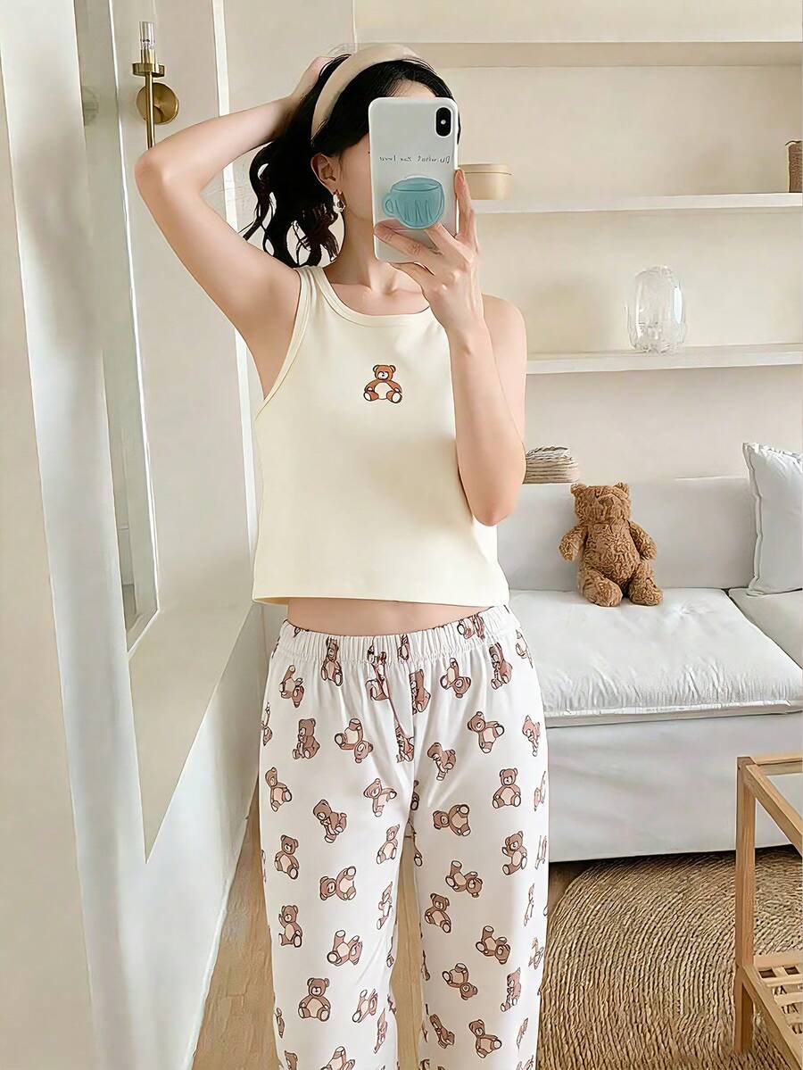 女童休闲简约睡衣套装（2件套），包含1件泰迪熊印花吊带背心和1条泰迪熊印花宽松长裤，适合春夏居家穿着。 - 杏色 - 查看 1