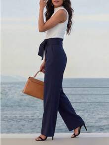 Bộ trang phục nữ mùa hè thanh lịch, giản dị, màu trơn, có túi thắt lưng và dây đeo. - Màu trắng và xanh đậm - Xem 3