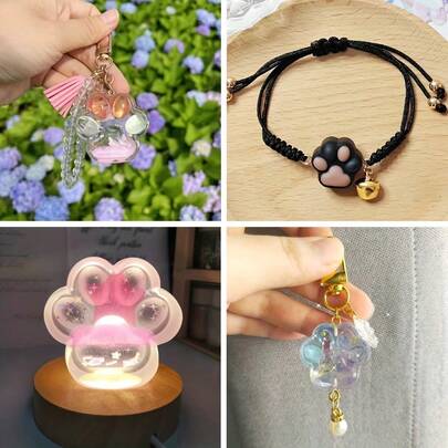 Un conjunto de 2 moldes de silicona con forma de pata de gato, adecuados para hacer con resina y epoxi. Ideales para proyectos, estos moldes de silicona vienen en tamaños grande y pequeño, diseñados para impresiones de patas detalladas en resina