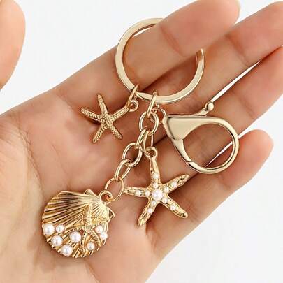 独特仿珍珠贝壳钥匙扣吊坠，金属心形海螺壳配饰，可爱奢华包包挂饰，适用于斜挎包/单肩包/手提包。手工/DIY钱包配饰，仿海星包包挂饰，海洋风包包挂饰，仿水果包包挂饰，女士包包挂饰，链条包包挂饰，金色包包挂饰，银色包包挂饰，仿海螺包包挂饰，仿贝壳包包挂饰