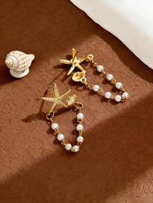 一对精致清新的小众星形贝壳珍珠耳环，百搭款式，适合派对、送礼、日常佩戴。 - 金色 - 查看 2