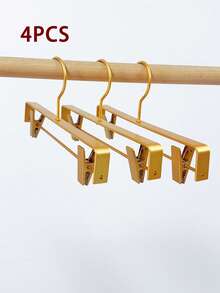 4个可调节铝合金裤/裙衣架，无缝衣柜收纳架，多功能衣橱整理架，适用于裤子、裙子和配饰，节省空间，轻便耐用，防锈，防滑夹子，方便取用衣物，非常适合小卧室和宿舍，是换季整理衣橱的理想之选，保持衣物整齐可见，最大限度地利用悬挂空间，坚固耐用，外观时尚。 - 金色 - 查看 8
