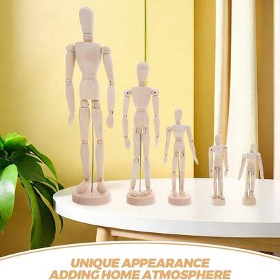 木制可动人体模型，可摆姿势，用于绘画素描，关节灵活，是艺术创作的理想选择。这款优质艺术用品适用于素描、绘画等艺术创作，也可作为复古木制工艺桌面摆件，简约风格，是家居、客厅、办公桌装饰的理想之选。此外，它还是一款极具收藏价值的木制人偶装饰摆件，是艺术学生练习人体素描的实用工具，也是创意十足的可摆姿势木制艺术模型，适用于家庭办公室装饰和艺术学习工艺摆件。